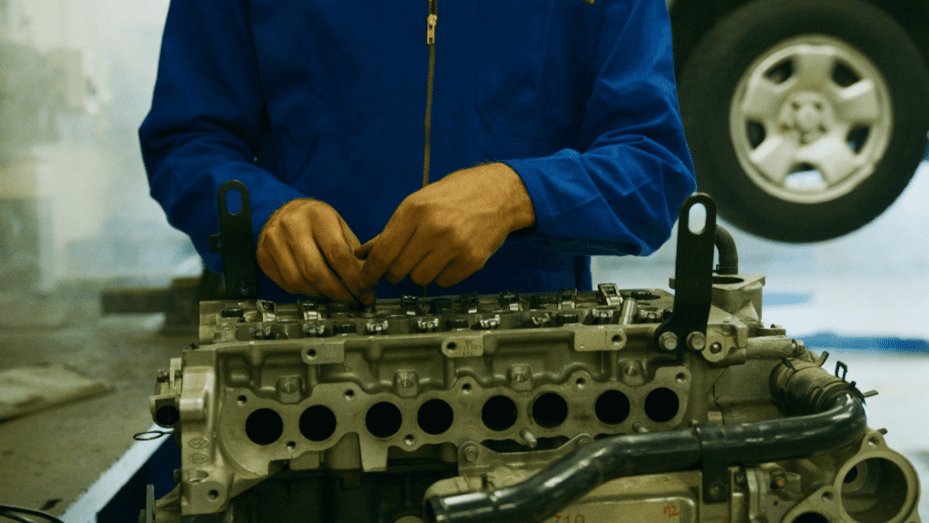 A technician skillfully repairing a motor part at a repair workshop