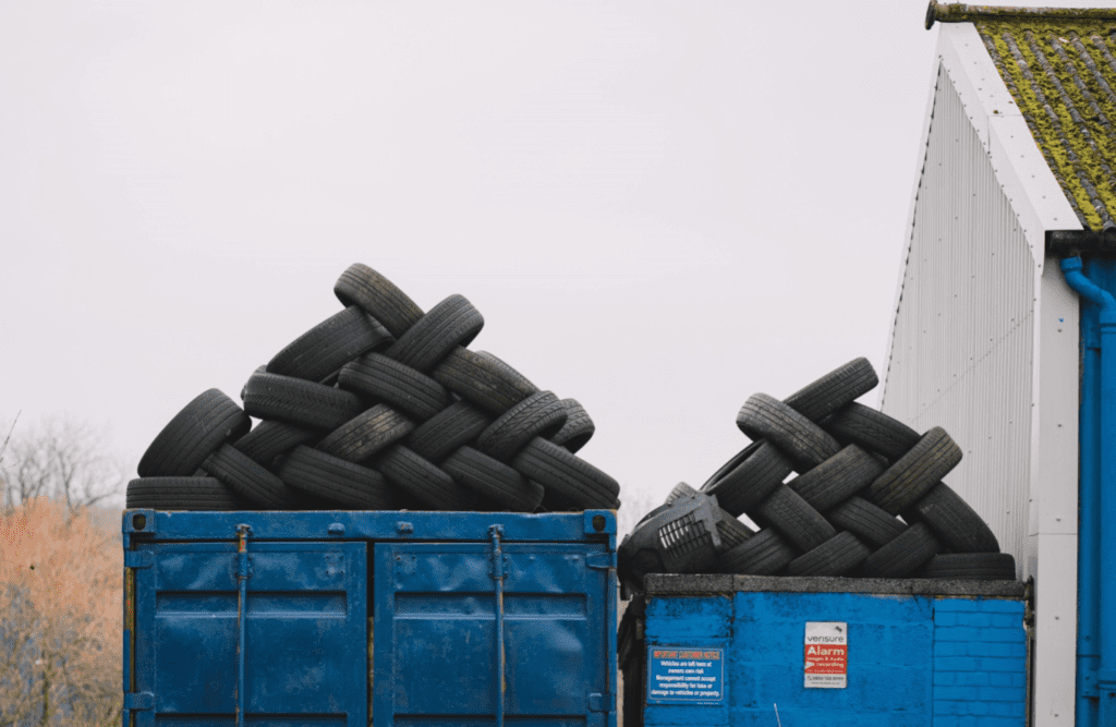 piles of tires in containers