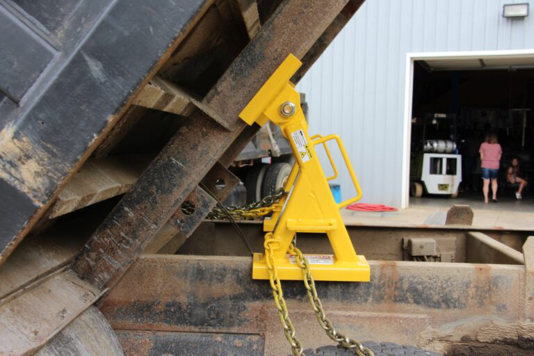A dump truck bed safety stand to ensure safety during repair.