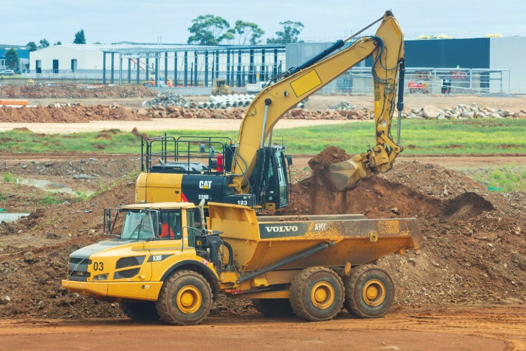 Excavator and dump truck on a construction site