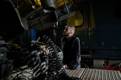 A mechanic at a truck repair shop