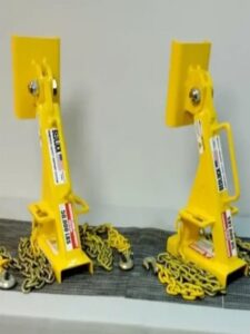 Two certified truck bed locks displayed on a table, ready for deployment in maintenance operations