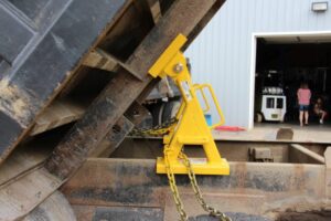 Dump truck bed raised with two bed locks installed underneath
