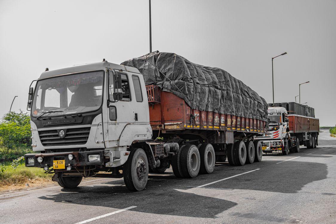 Heavy cargo trucks traveling on a highway