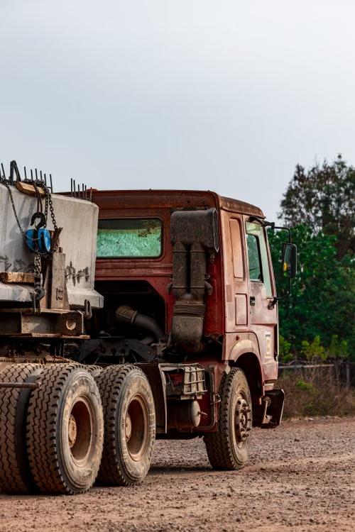 Heavy-duty dump truck on a gravel road
