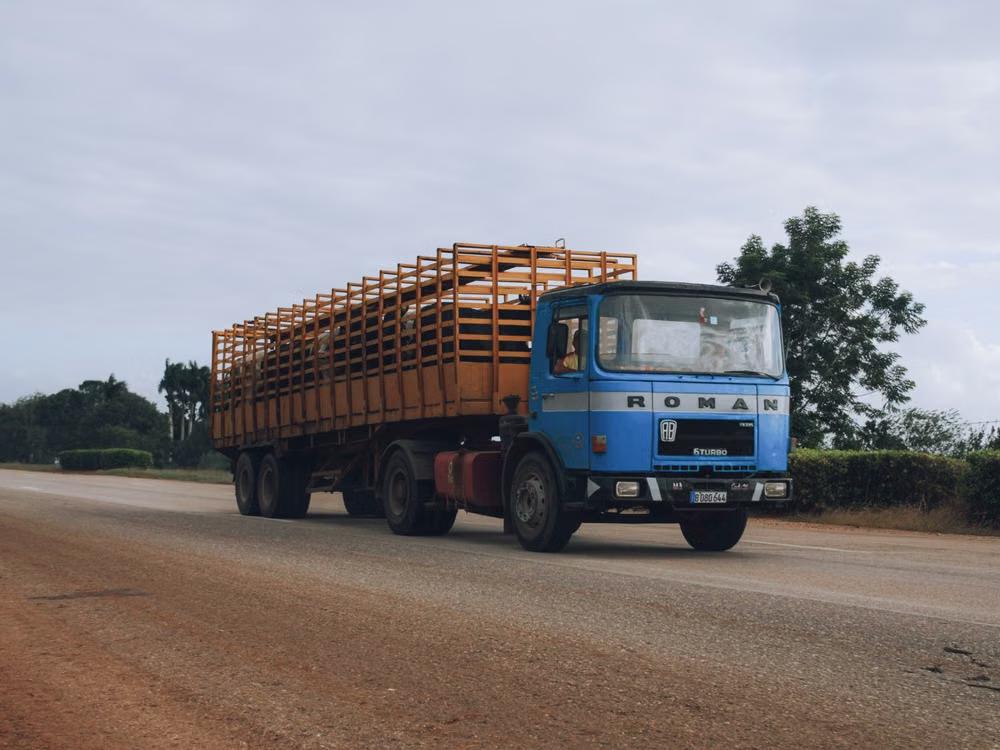 Blue heavy-duty truck on a roadway